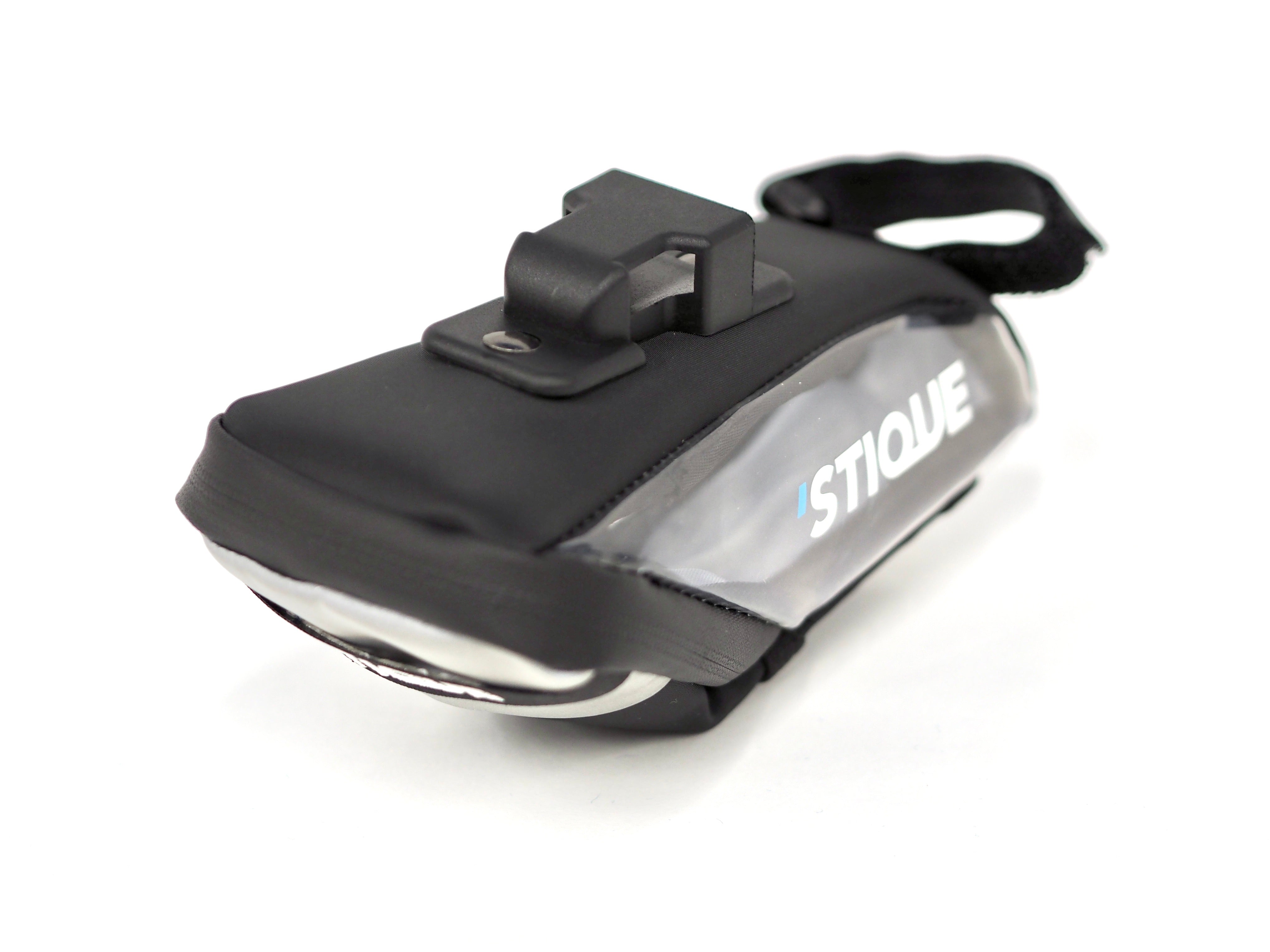Close-up of Stique SaddleGuard bike saddle bag showing bracket attachment and side panel branding on white background