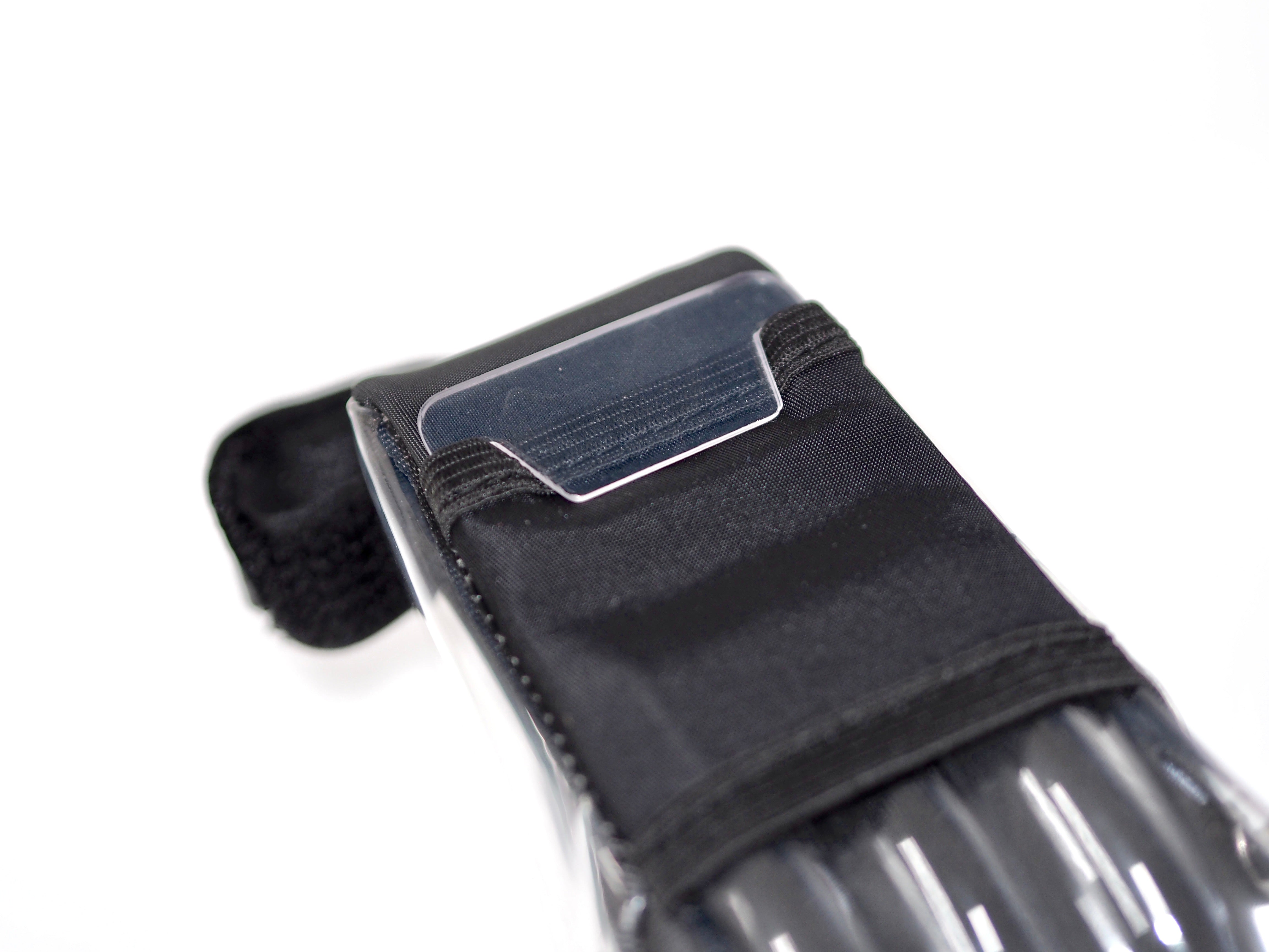 Close-up of Stique SaddleGuard showing rear reflective panel and Velcro strap for secure attachment